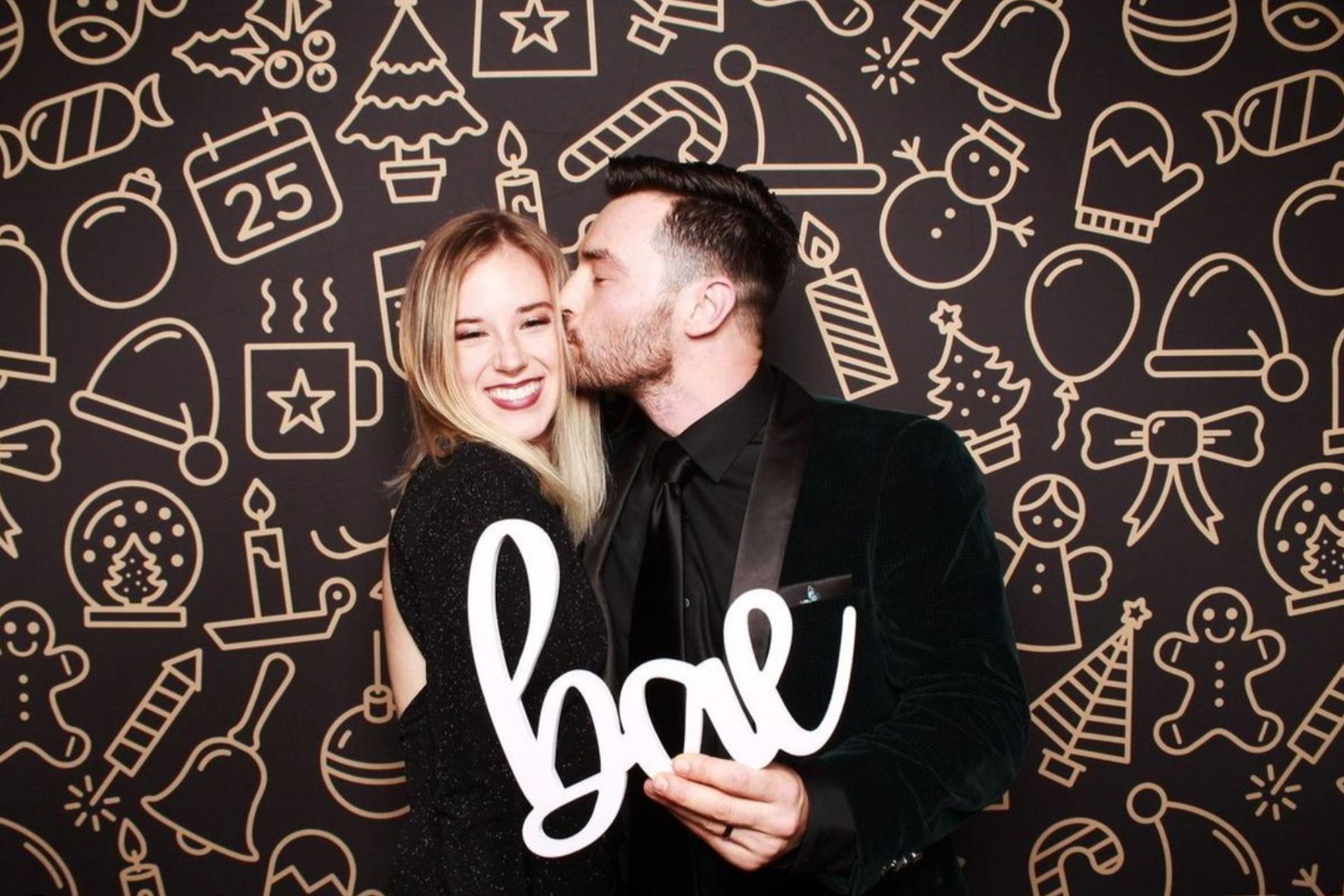 Guests at holiday party photo booth